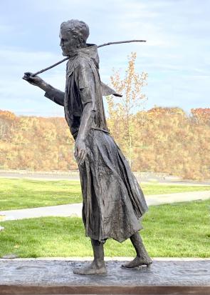 St Francis walking in the Footsteps of Jesus by John Collier. Bronze 8 Feet in Height